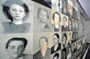 TO GO WITH AFP STORY - Photographs of prisoners murdered at the Ravensbrueck concentration camp for women line a wall in the "Place of Names" memorial at the camp in Fuerstenberg February 24, 2009.  The "Sex Slavery in Nazi Concentration Camps" exhibition which opened at the Ravensbrueck concentration camp memorial, sheds light on the fate of women prisoners, many of which came from the Ravensbrueck camp, forced to provide sex to inmates in other concentration camps.   AFP PHOTO JOHN MACDOUGALL (Photo credit should read JOHN MACDOUGALL/AFP/Getty Images)